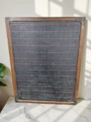 A late 19th century stained pine framed chalk board, 101 cm x 129 cm.