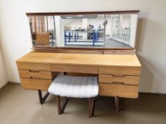 A 20th century teak mirror back dressing table, width 153 cm,