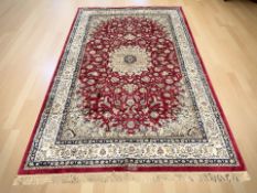 A machine-made carpet of Iranian Isfahan design,