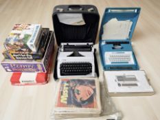 Two typewriters, a stylophone, a group of vintage games, comics including Misty, etc.