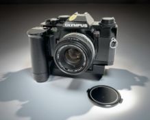 An Olympus OM40 Program 35mm film camera, with Zuiko MC Auto-S 1:1.8 f=50mm lens and auto winder.