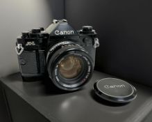 A Canon A-1 35mm film camera, with Canon FD 50mm 1:1.4 S.S.C lens.