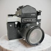 A Soviet Kiev-60 medium format film camera, with TTL prism viewfinder and Arsat C 1:2.8 80mm lens.