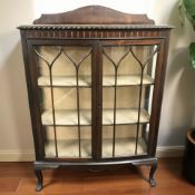 An early 20th century mahogany bow fronted display cabinet,