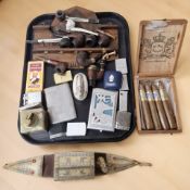 A collection of pipes, a carved wooden pipe rack, cheroot, lighters including Zippo, Ronson,