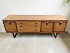 A Beautility teak low sideboard, fitted cupboards and drawers, 184 cm x 46 cm x 73 cm.
