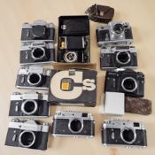 A collection of Russian / Soviet rangefinder camera bodies including Zenit, Kiev, Prinzflex, Nomo,