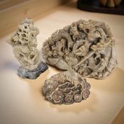 A 20th century Chinese heavily carved soapstone figure group depicting coiled dragons, width 19 cm,