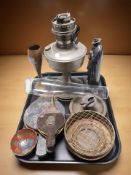 A silver plated table lighter in the form of a knight, together with an antique oil lamp,