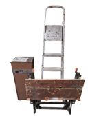 An aluminium step ladder, an Amcor dehumidifier and a folding workbench.