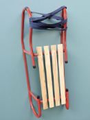 A metal and pine sledge.