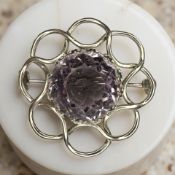 A vintage silver amethyst brooch