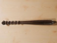 A turned wooden truncheon, length 41 cm.