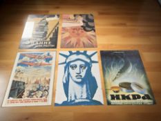Five reproduction glazed posters including Soviet propaganda examples, 40 cm x 30 cm.