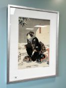 Japanese School : Figure kneeling by a tree, hand coloured print, 23 cm x 35 cm.