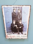 A reproduction The Beatles tin sign, 70 cm x 50 cm.