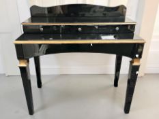 A contemporary high gloss side table,