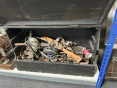 A painted joiner's tool box containing hand and power tools