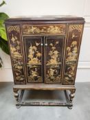 A mid-20th century Chinoiserie double door gramophone cabinet, 73 cm x 55 cm x 115 cm.