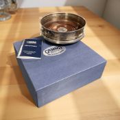 A silver and mahogany bottle coaster by Carrs Sheffield, diameter 12.