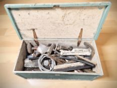 A painted joiner's tool box containing various tools