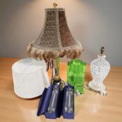 A group of contemporary decorative table lamps, a pair of boxed candlesticks.