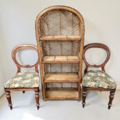 A pair of Victorian mahogany occasional chairs and a wicker open shelf, width 62 cm.