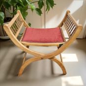 An adjustable walnut X-framed chair, width 52 cm.