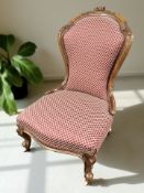 A Victorian carved walnut lady's salon chair.