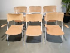 A set of six Italian Calligaris metal and stitched tan leather dining chairs,