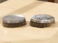 Two silver-mounted dressing table brushes, width 14 cm.