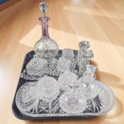 A group of crystal dressing table items, decanter and stopper, pair of pressed glass candlesticks,