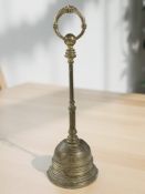 A Victorian brass door porter, height 42 cm.