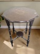 An Edwardian shaped top occasional table.