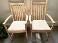 A pair of Ercol elm armchairs, width 59 cm.