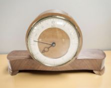 An Art Deco walnut mantel timepiece, width 29 cm.