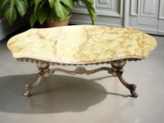 A gilt metal and onyx coffee table, width 115 cm.