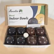A box of Henselite biased indoor bowls.