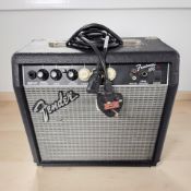 A Fender Frontman 15G amplifier with lead.