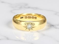 A 22ct gold gypsy-set diamond band ring, size N CONDITION REPORT: 8.
