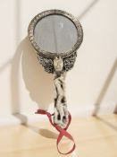 A 20th century Chinese hand mirror with carved jade handle in the form of a ruyi scepter,