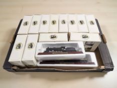 Atlas Editions die cast model trams, together with two further die cast models of locomotives.