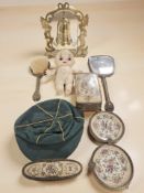 A brass bell on stand with beater, a group of petit point dressing table items,