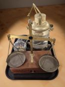 A masthead ship's lamp wired for electricity, a set of balance scales,