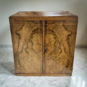 A Victorian burr walnut and satinwood-strung three drawer table cabinet, with key, height 28 cm.