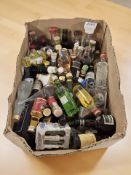 A collection of alcohol miniatures, many unopened including Bols, Grand Marnier, Gordons, etc.