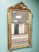 A gilded 19th century style over mantel mirror, 89 cm x 157 cm.