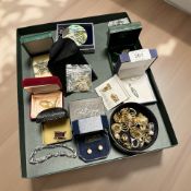 A small group of costume jewellery including various pendants, gold plated clip-on earrings,