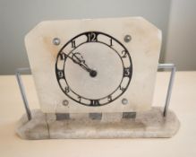 An Art Deco alabaster electric mantel timepiece, width 32 cm.
