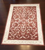 A machine made rug of Zeigler design, 230 cm x 160 cm.